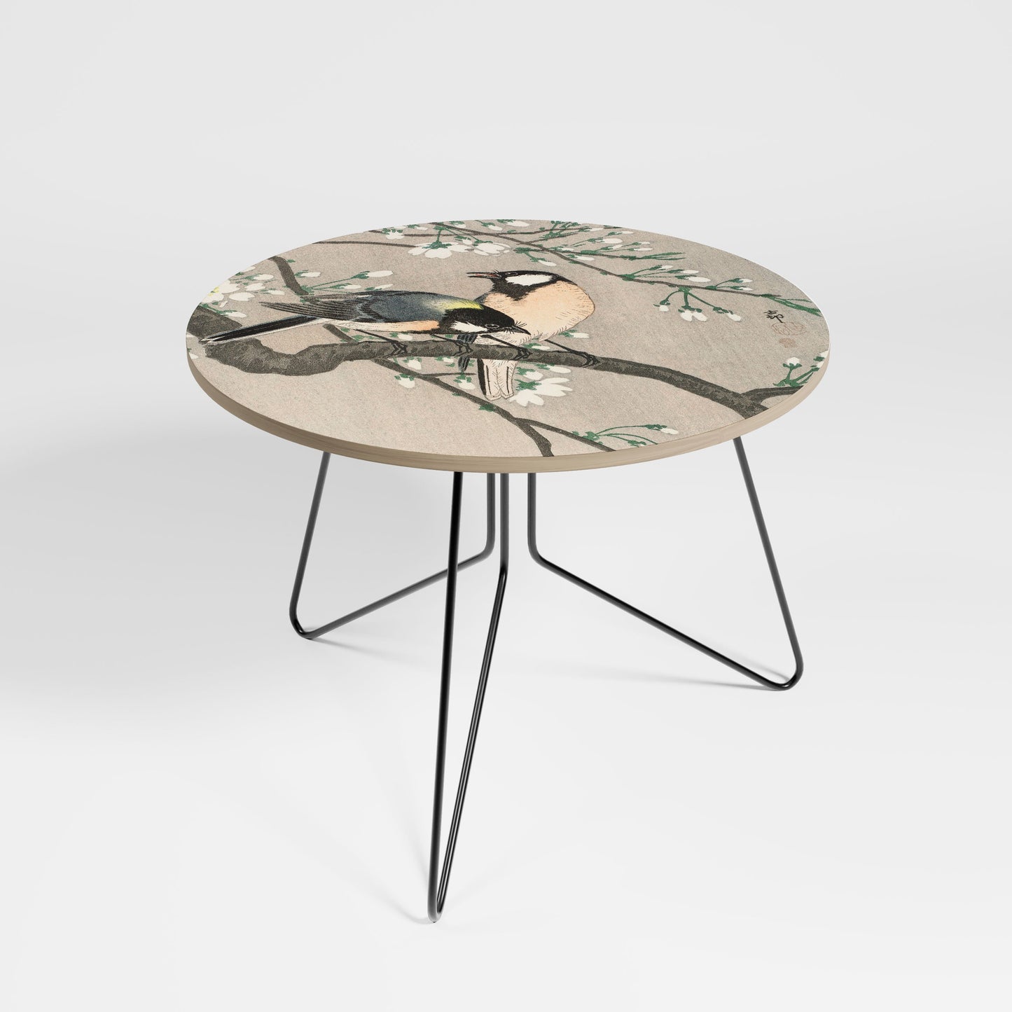 Grande table basse avec des seins sur une branche de cerisier